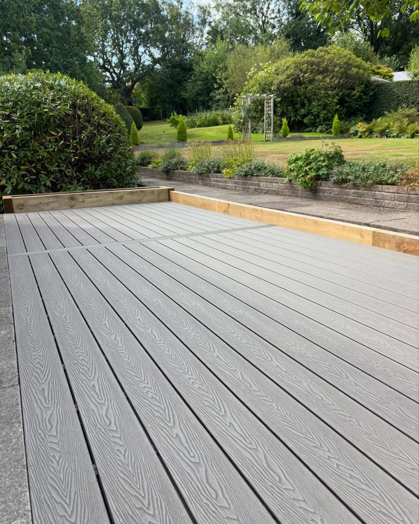 Landscaped garden with modern grey decking and paving